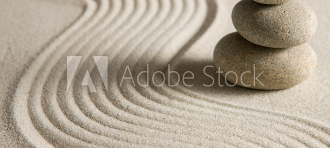 Fotobehang stenen in het zand
